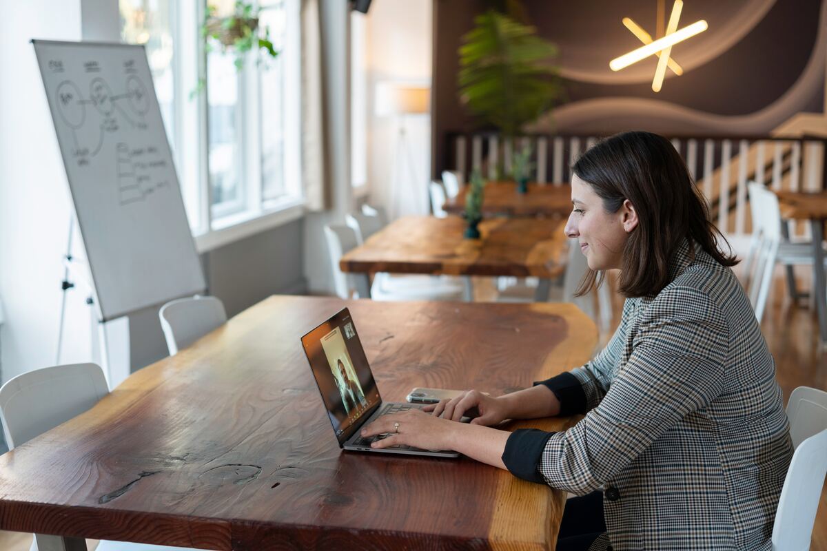 An HR Specialist & HR Generalist Chatting Via Zoom In An Office Space