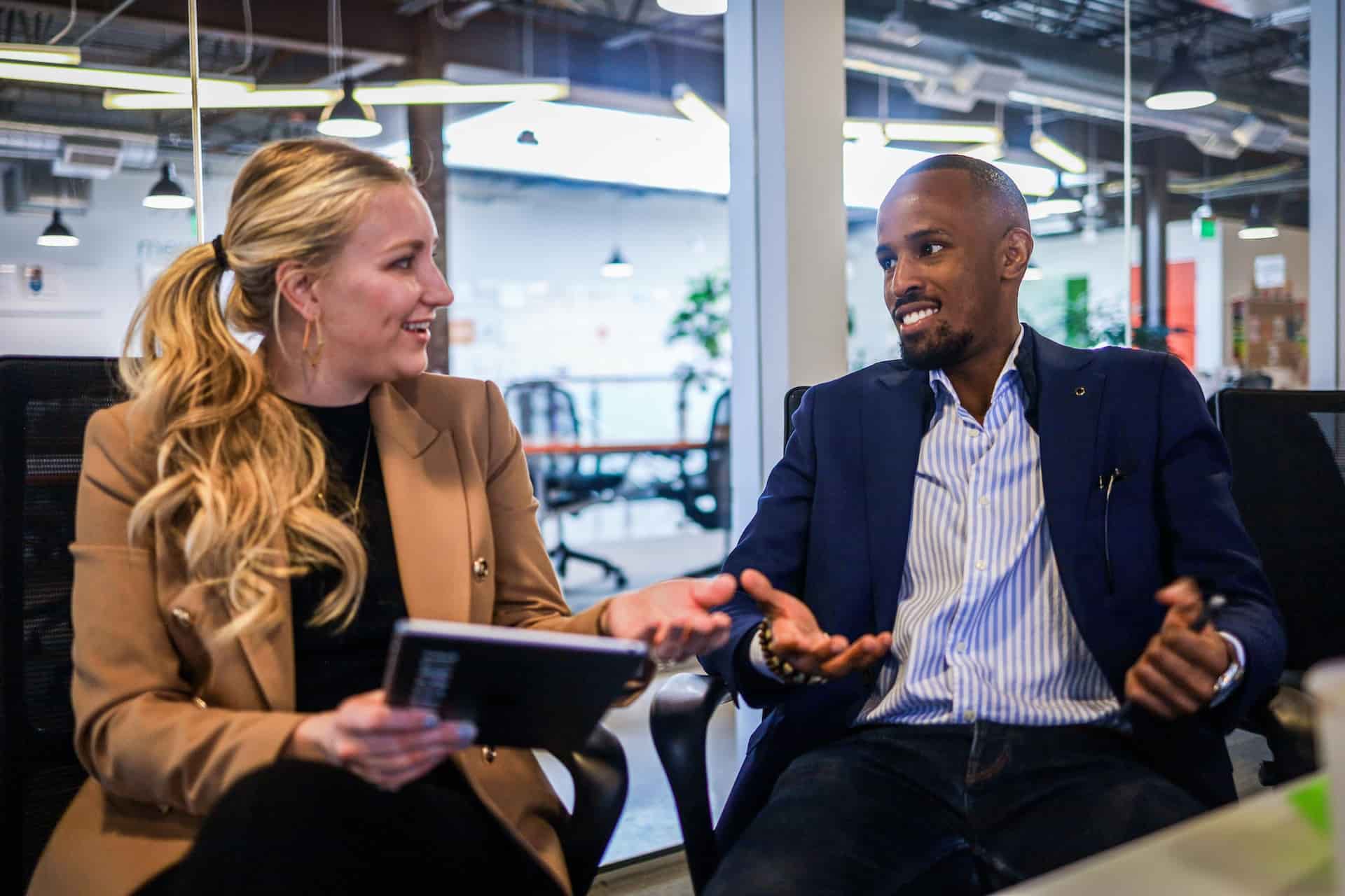 Two Labor Relations Specialists Talking At Work