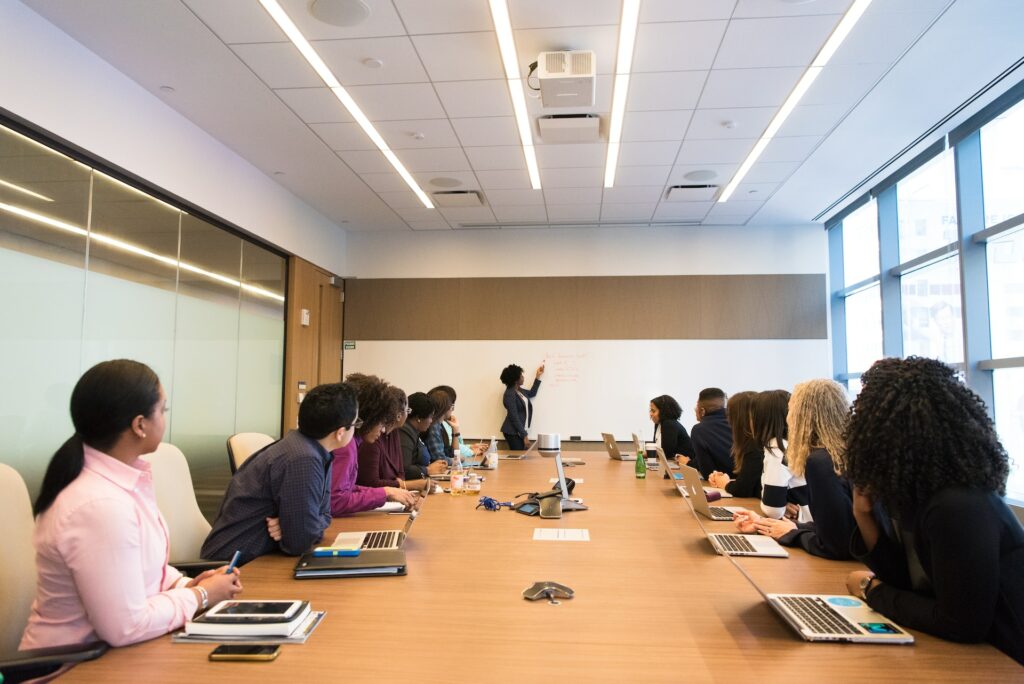 A compensation manager leading a conference meeting in the workplace