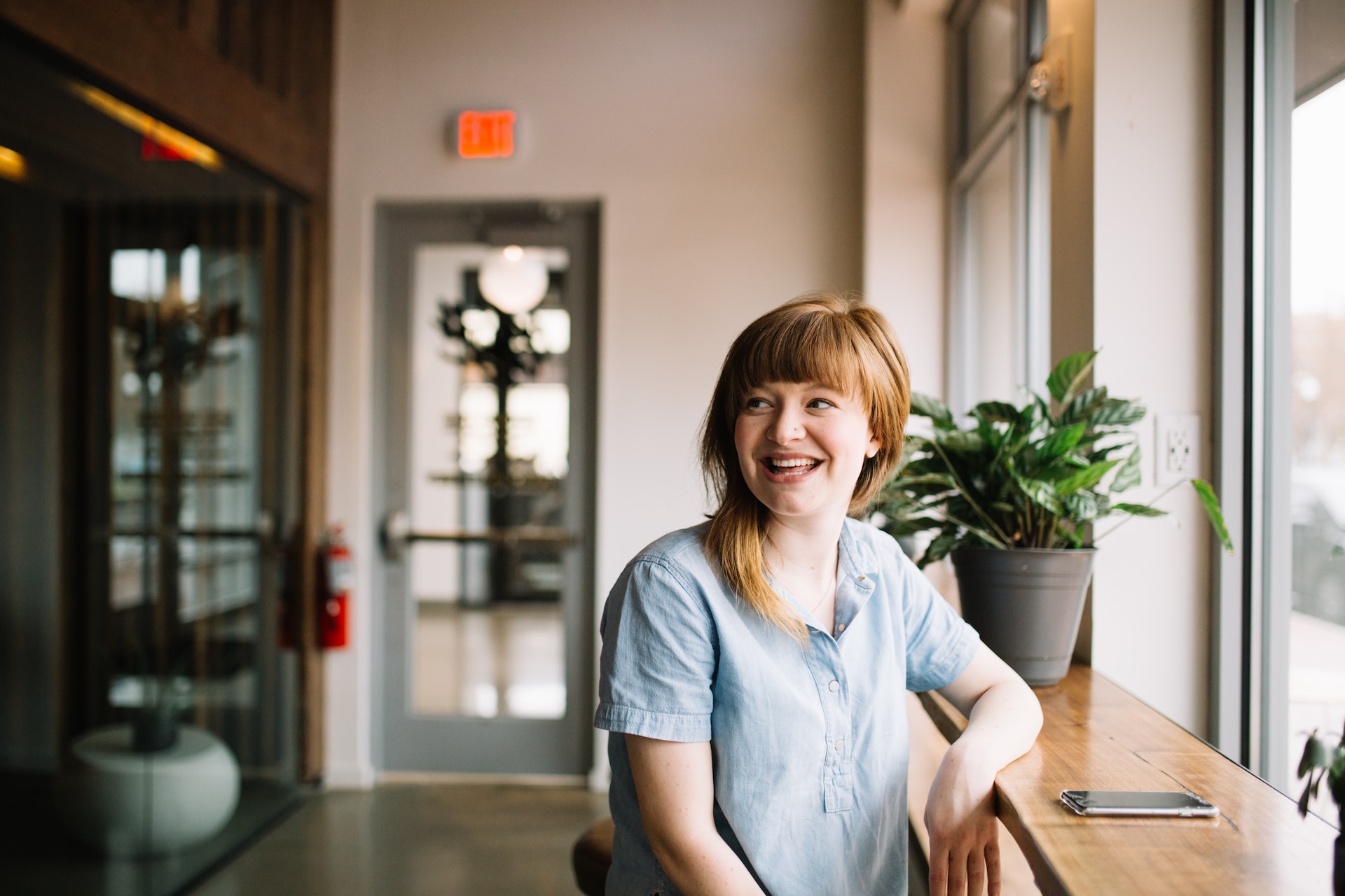 A Woman Studying Which HR Certification Is Best In A Modern Office Space