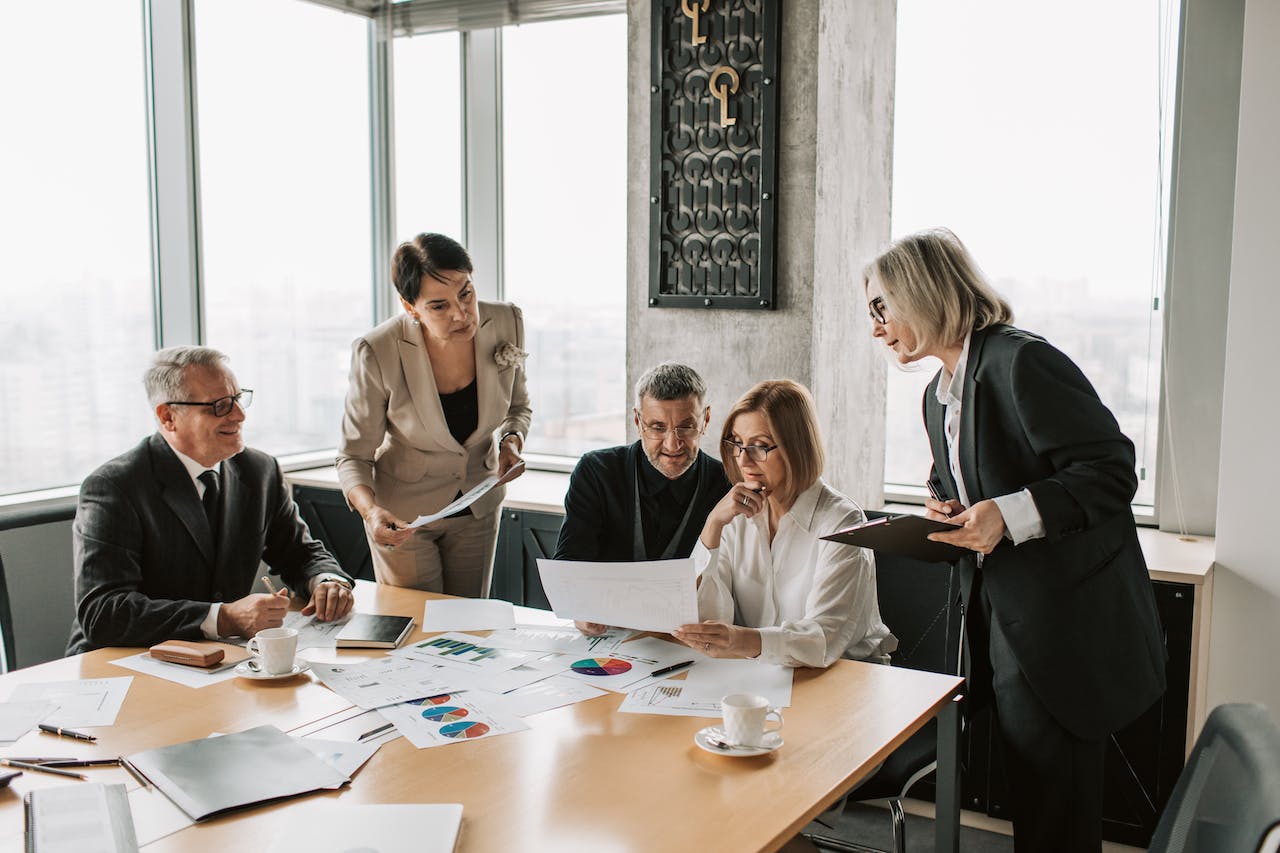 A Group Of Senior HR Executives Discussing Around A Conference Table