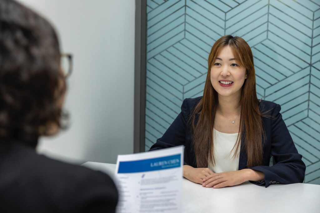 A woman in a job interview discussing her HR skills