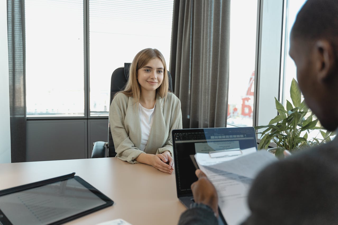 A Woman Smiling In An Entry Level HR Job Interview