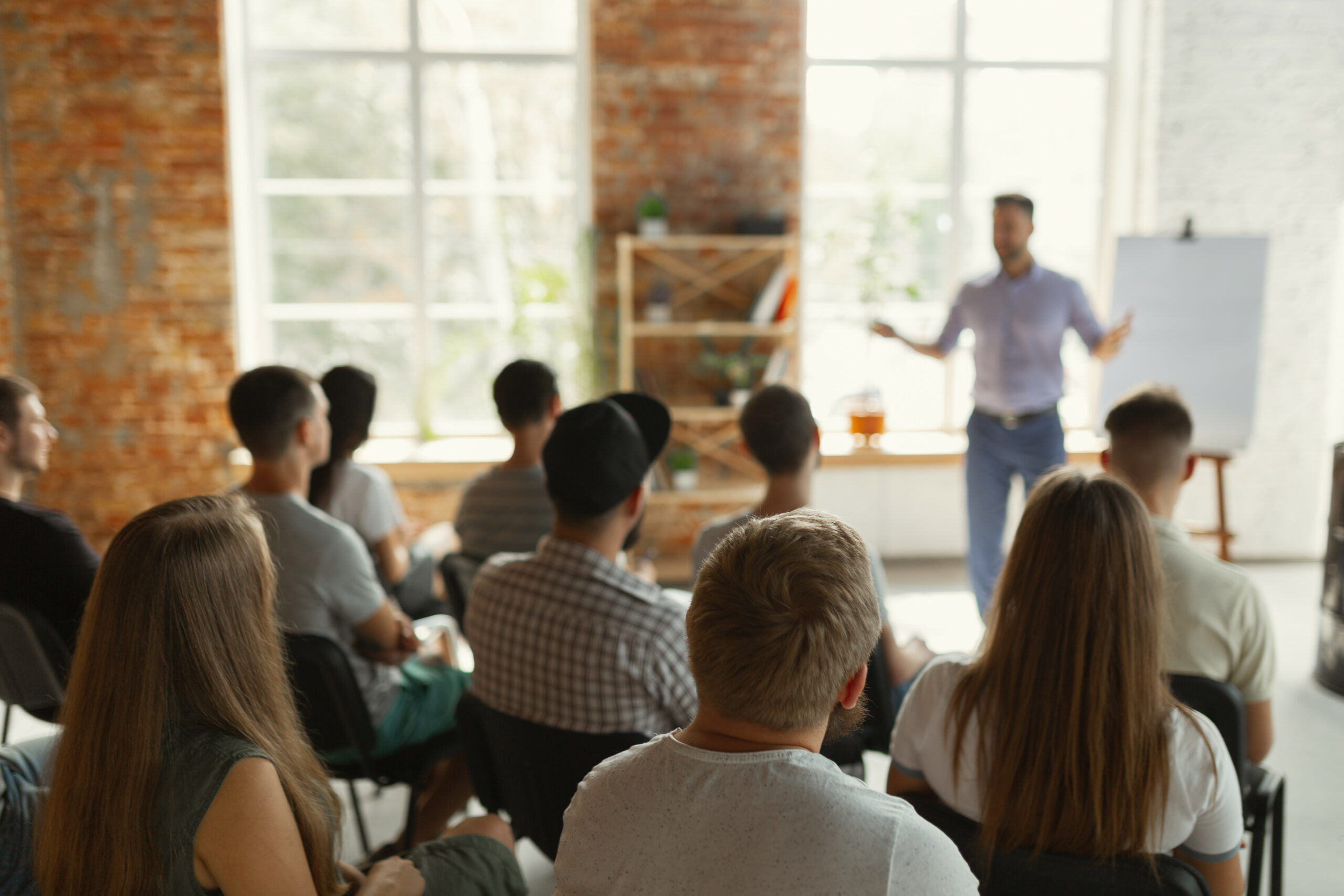 Male Speaker Conducting Workplace Safety Training For A Company And Its Employees