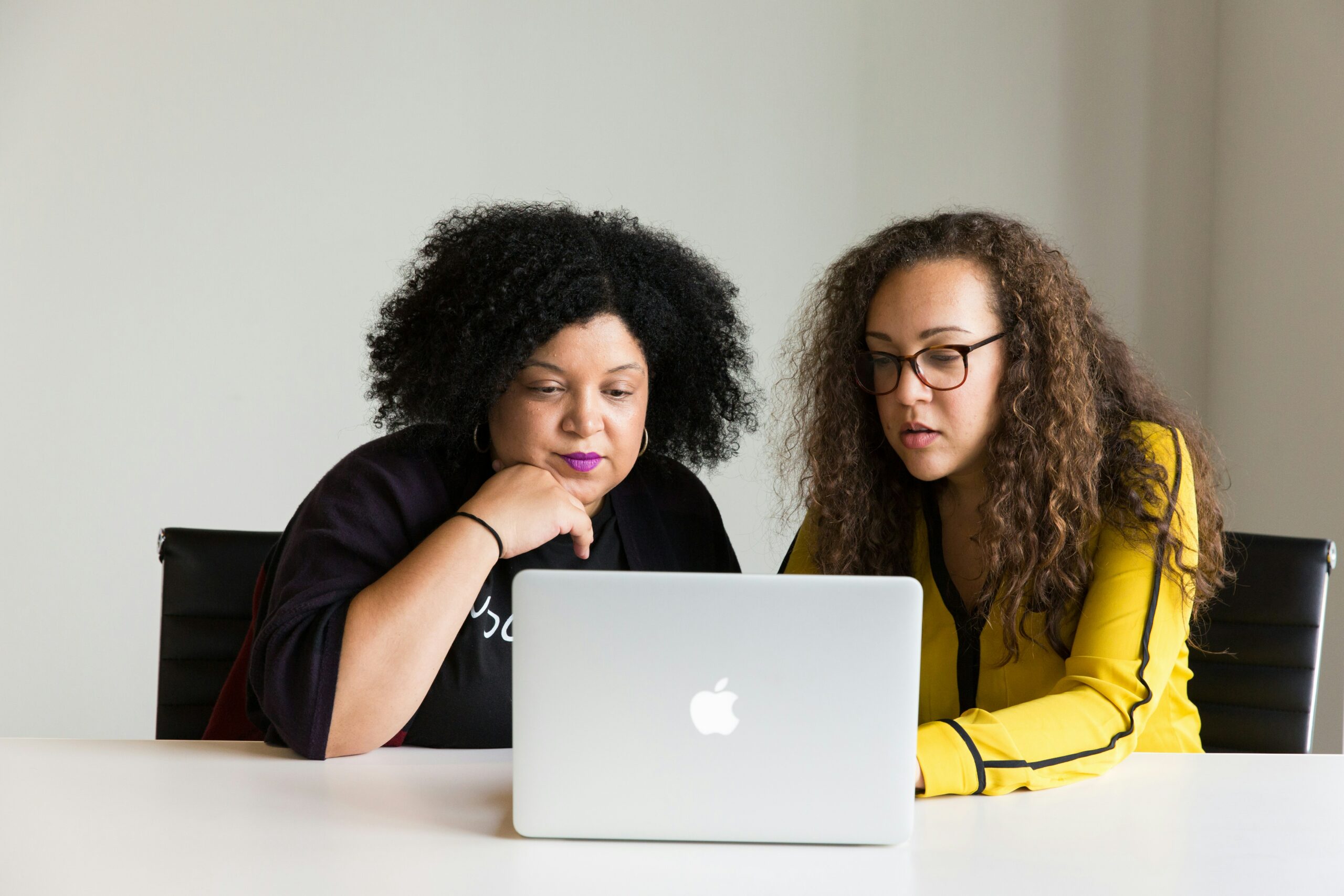 Two Women Working On A Human Resources Practice Test
